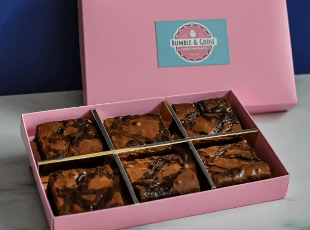 a pink custom brownie box with 6 delicious brownies