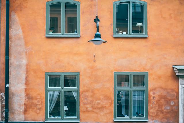 An orange vintage property with four windows