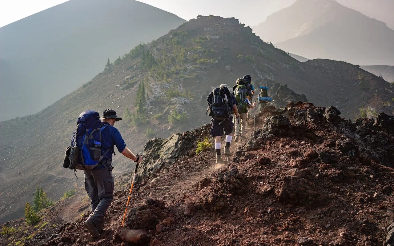 young men hiking in mountains